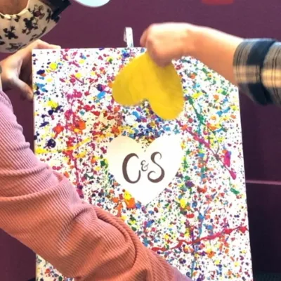 a hand holding a stuffed animal