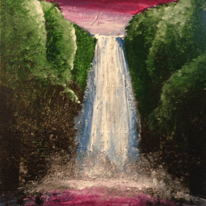 a large waterfall over a body of water