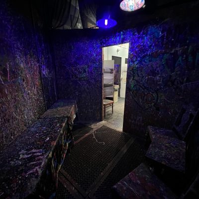 a purple light in a dark room