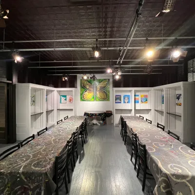 a group of people standing in a train station