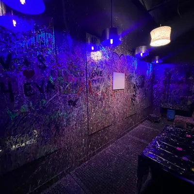 a purple light in a dark room