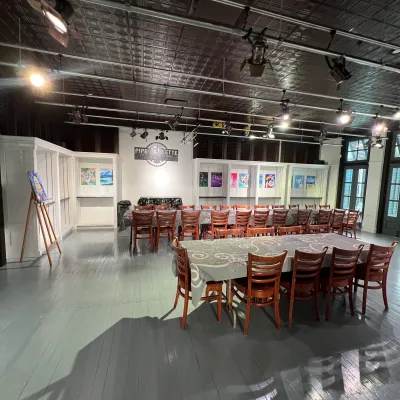 a group of people sitting at a table in a room
